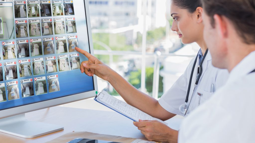 nurse looking at monitor